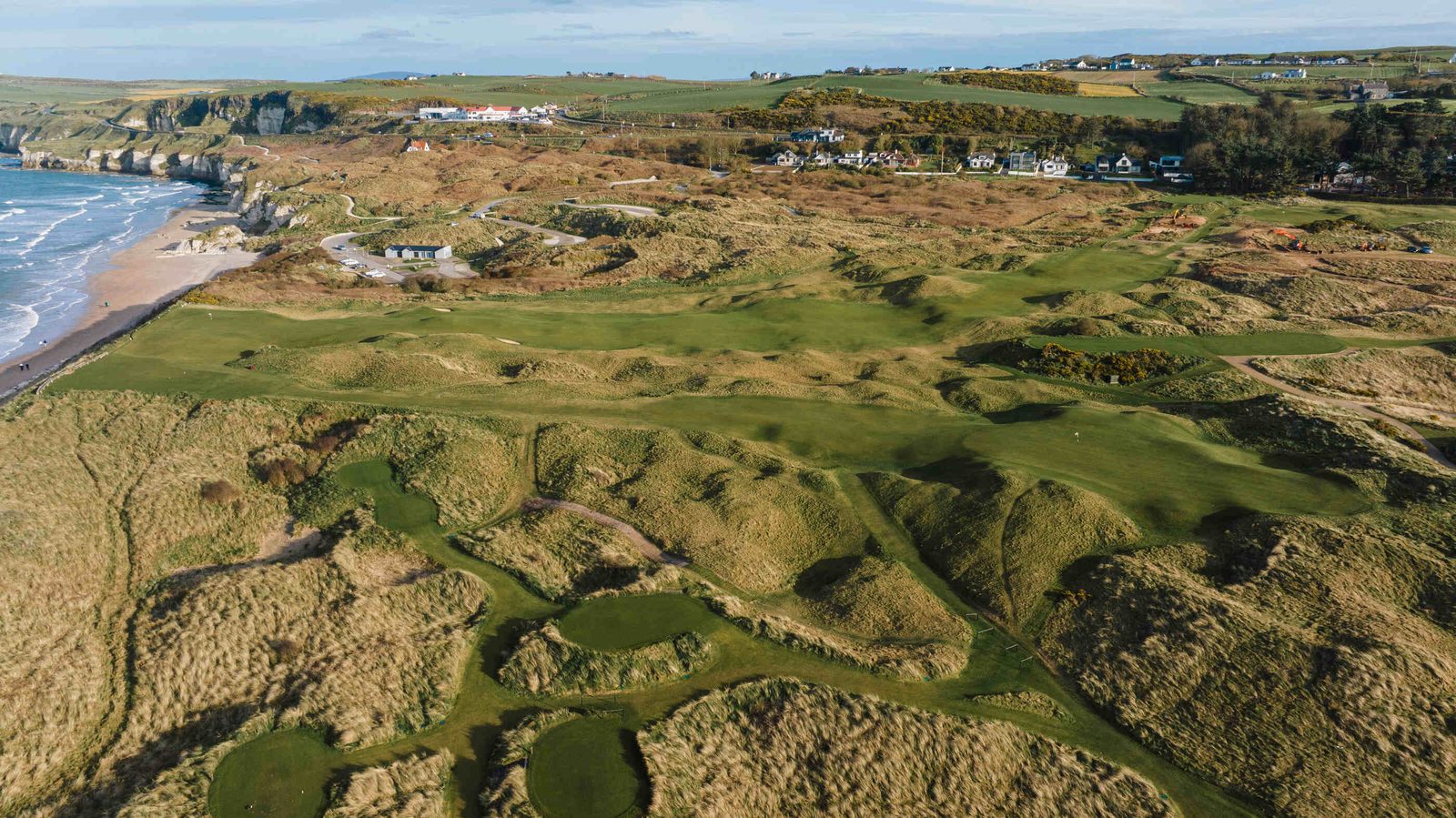 The Dunluce links at Royal Portrush sweeping along the Causeway Coast on a bright day