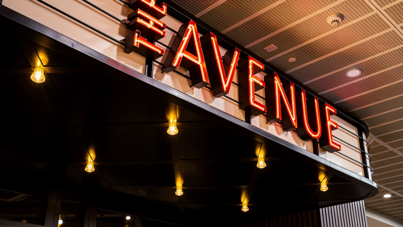 Neon signage above the cinema doors