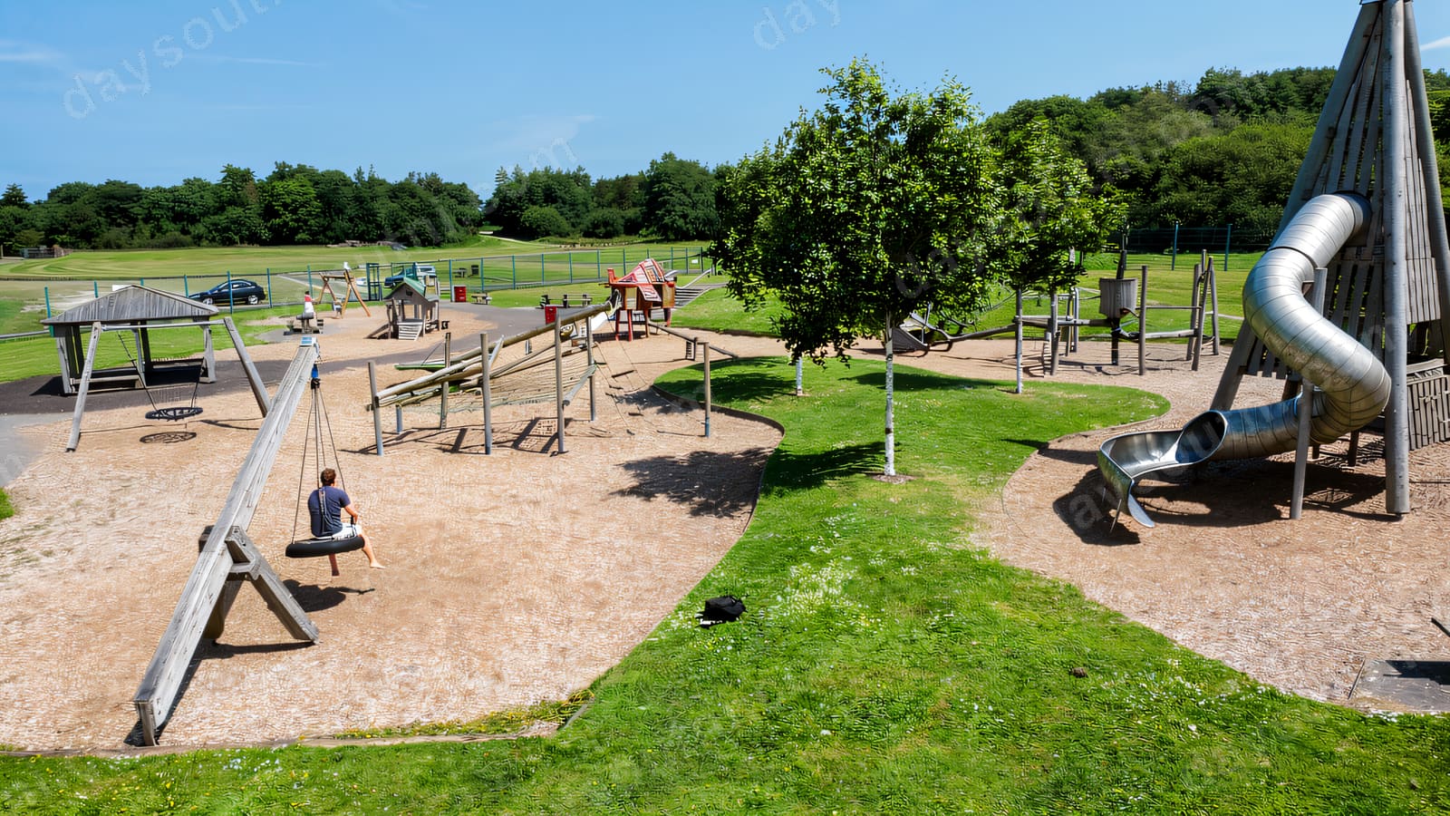 Climbing frames and swings on sand at Ballyarnet Country Park