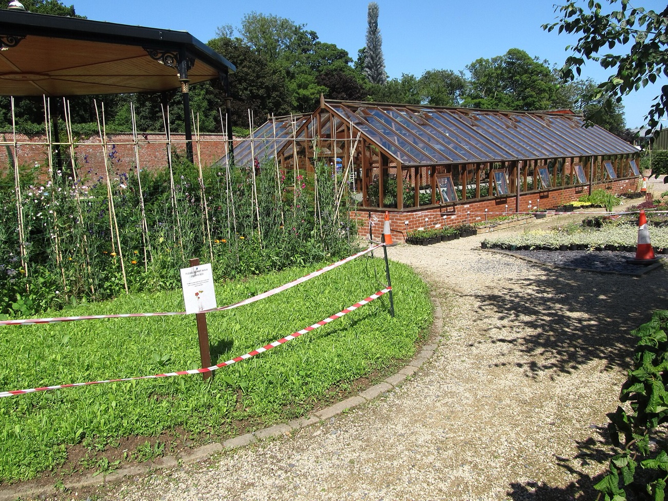 The restored glasshouse and kitchen-garden beds