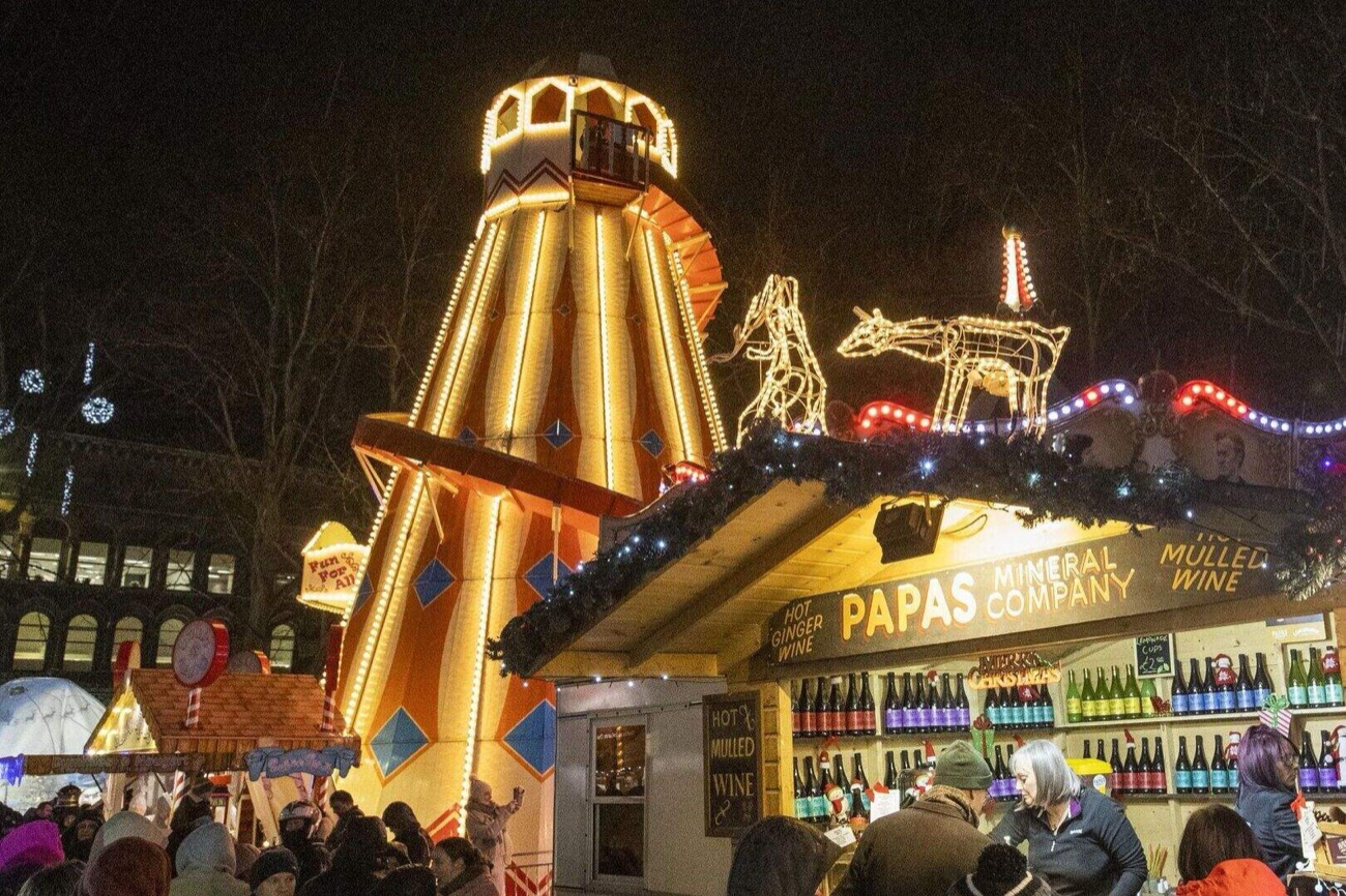 The illuminated helter-skelter and a mulled wine chalet glowing at the Belfast Christmas Market