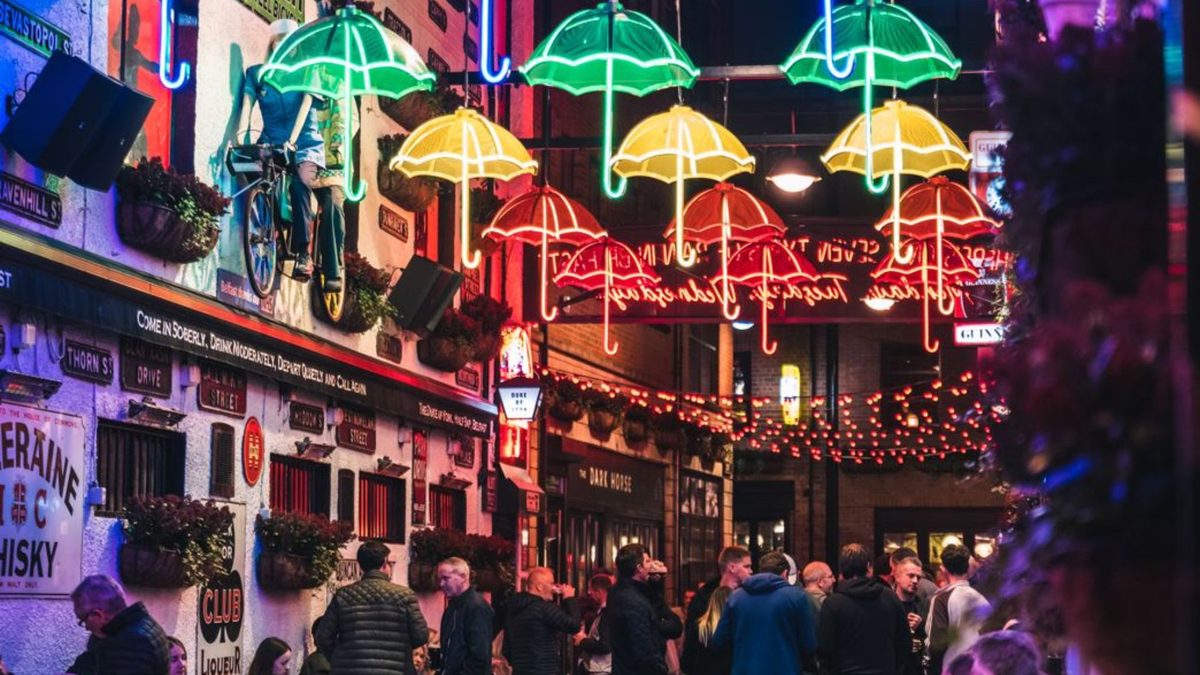 Crowds under the famous coloured umbrellas in Belfast's Cathedral Quarter, the heart of the festival