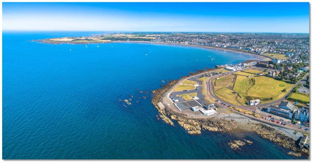 The rocky point at the edge of Ballyholme Bay from above, looking back towards Bangor