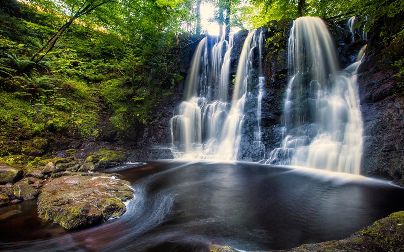 A waterfall on the boardwalk trail at Glenariff Forest Park
