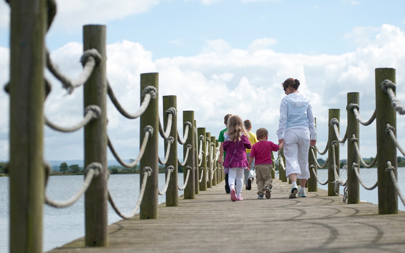 A family on the jetty at Oxford Island, Lough Neagh