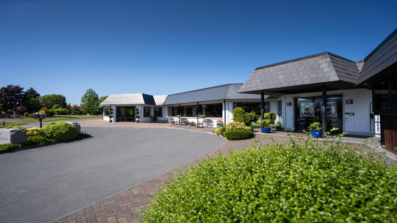 The Burrendale Hotel frontage under a clear blue sky.