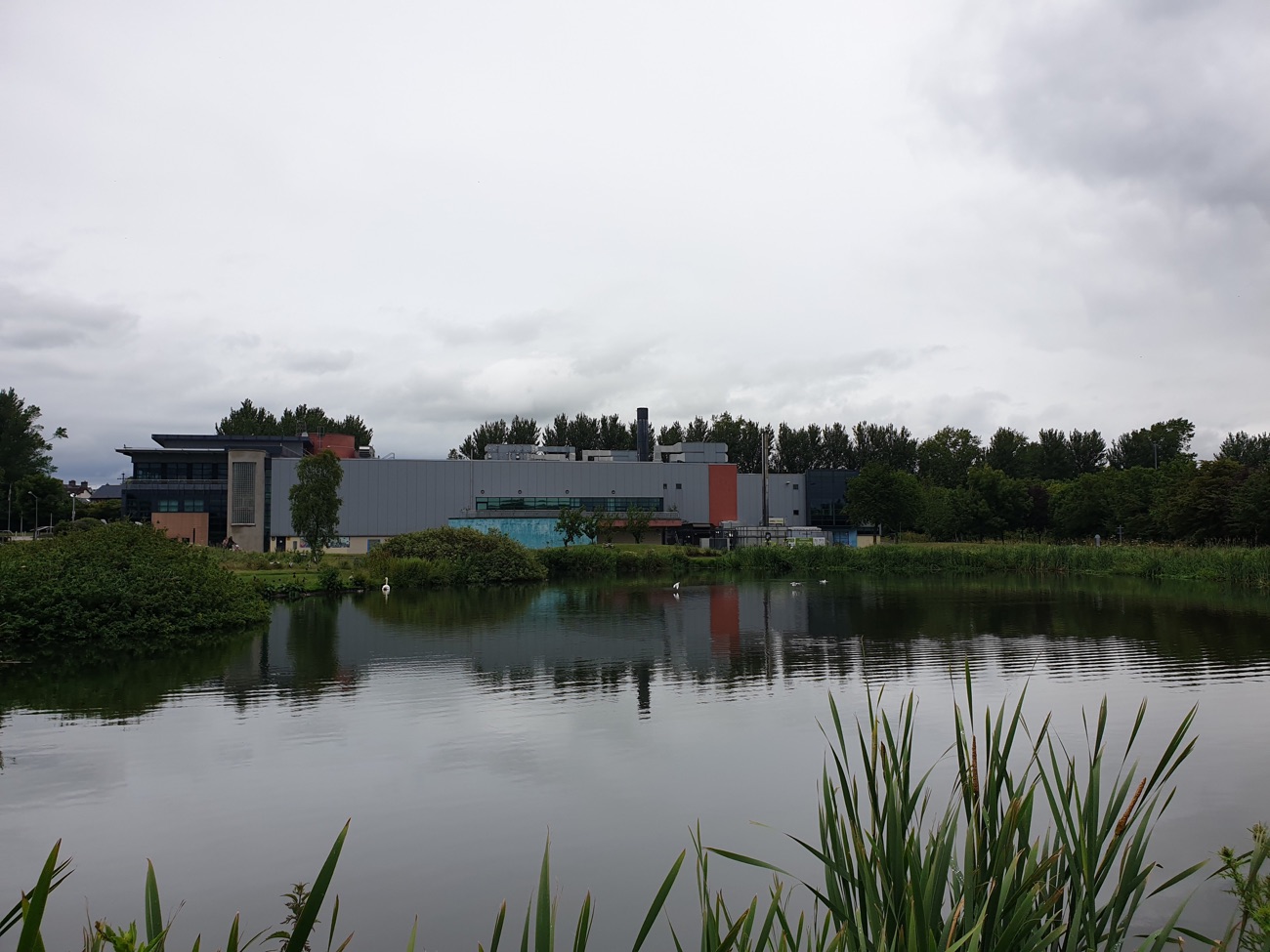 The mill pond with the modern Amphitheatre Wellness Centre buildings on the far bank