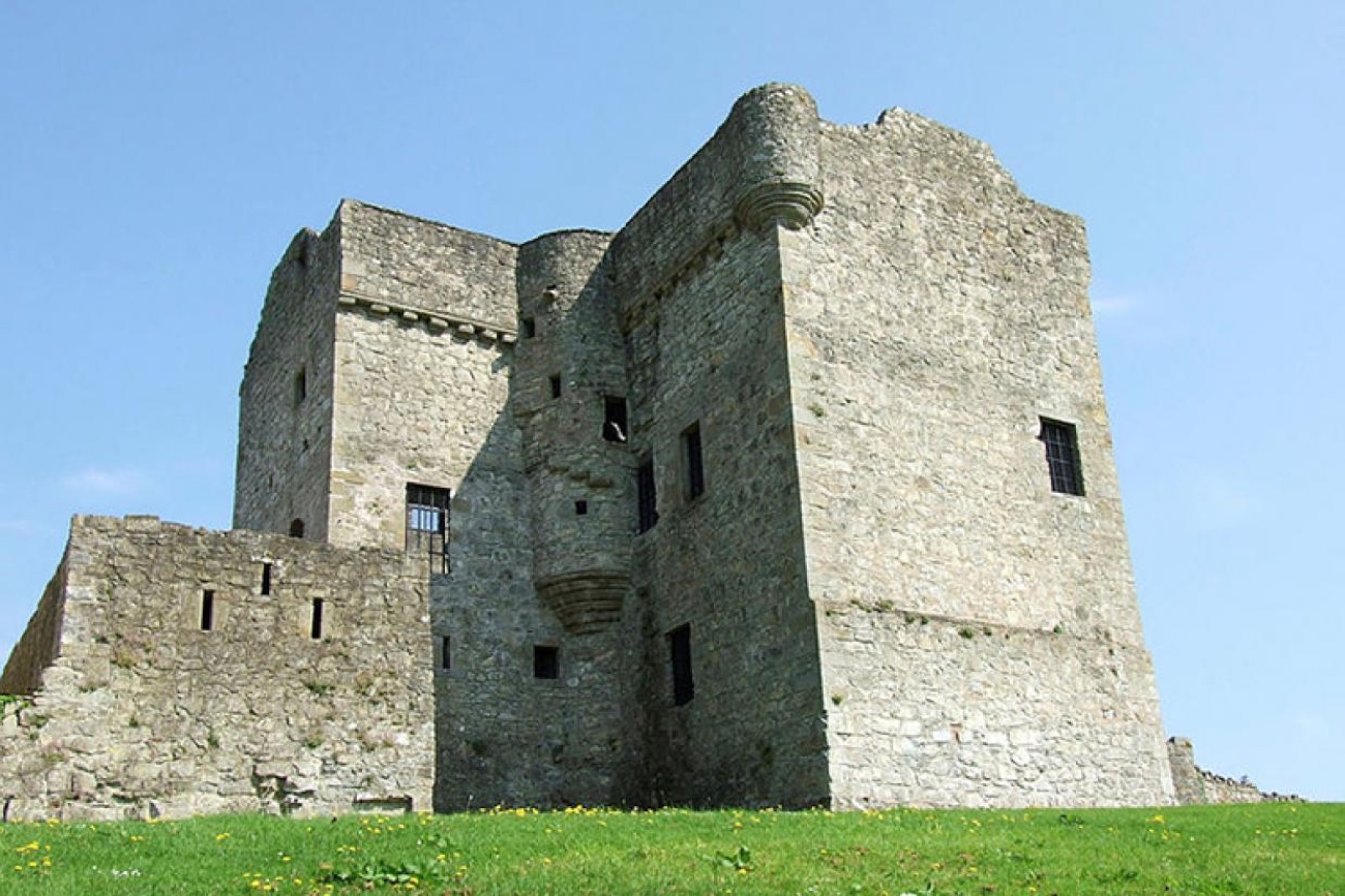Close-up of Castle Balfour's twin tower blocks with the corbelled stair turret and projecting bay between them
