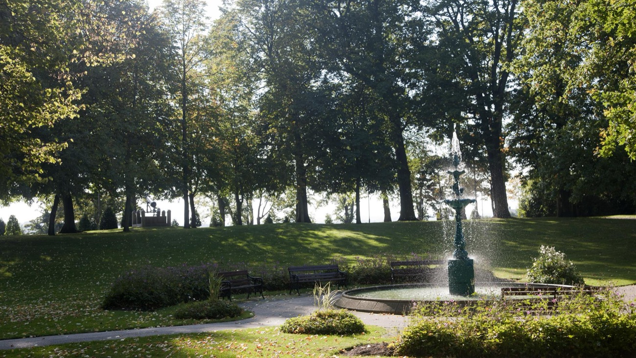 A green cast-iron fountain and pond in Castle Gardens, Lisburn