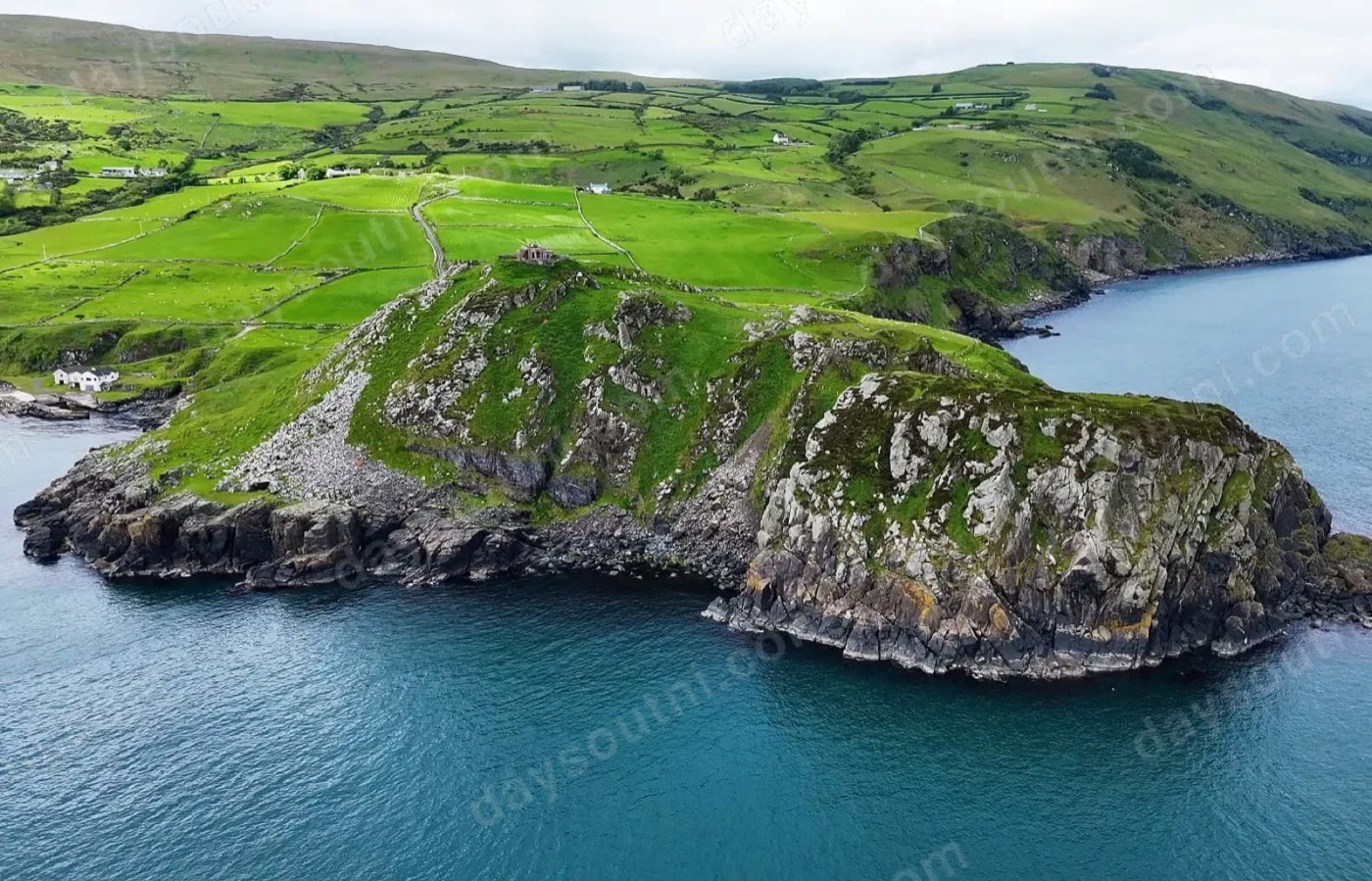 The headland and lookout station at Torr Head with Scotland beyond