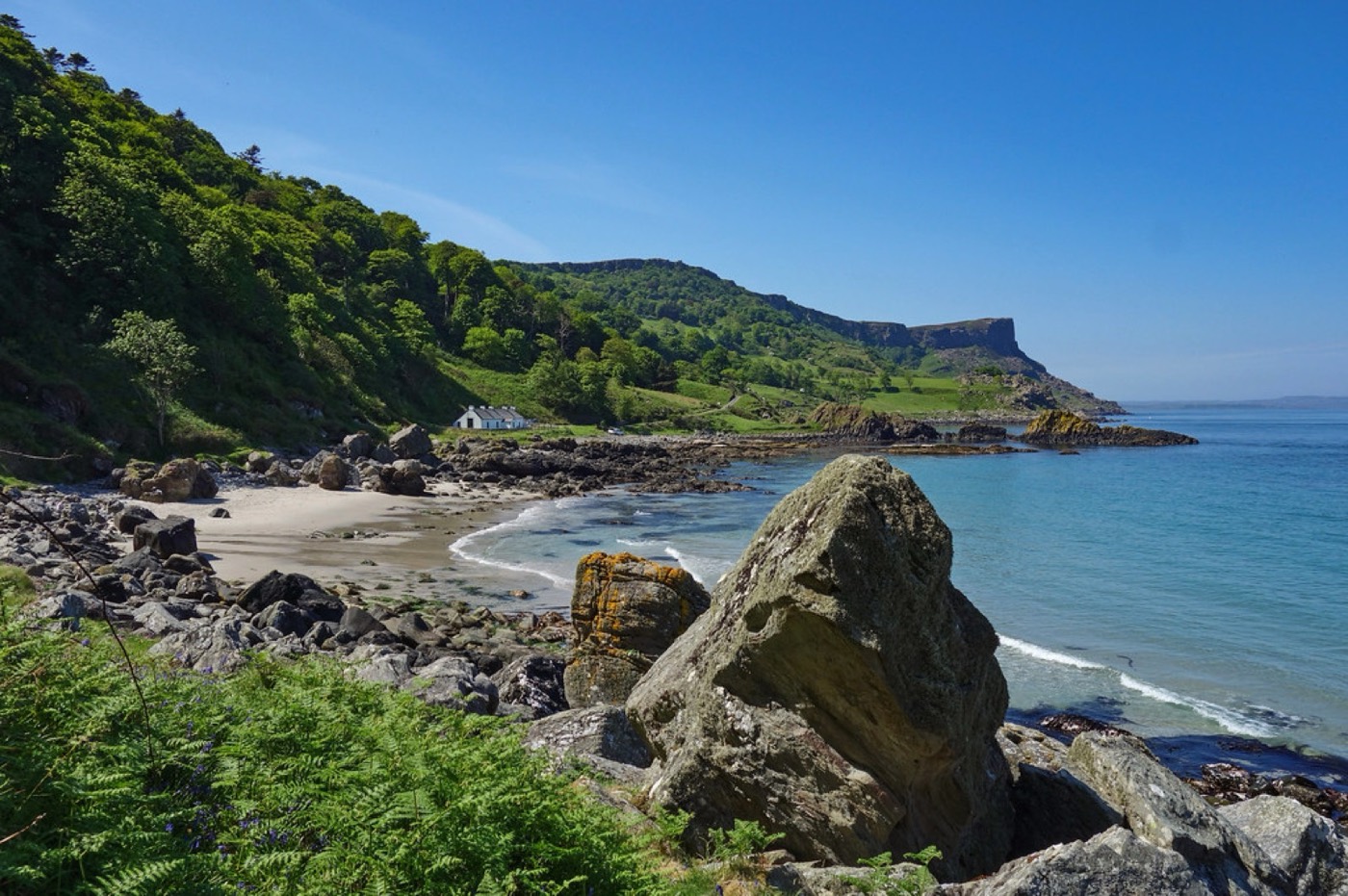 The green slopes and blue water of Murlough Bay near Ballycastle