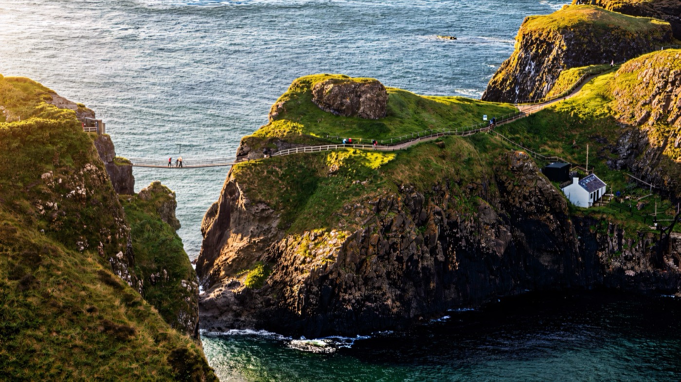 The rope bridge to Carrick-a-Rede island above blue sea