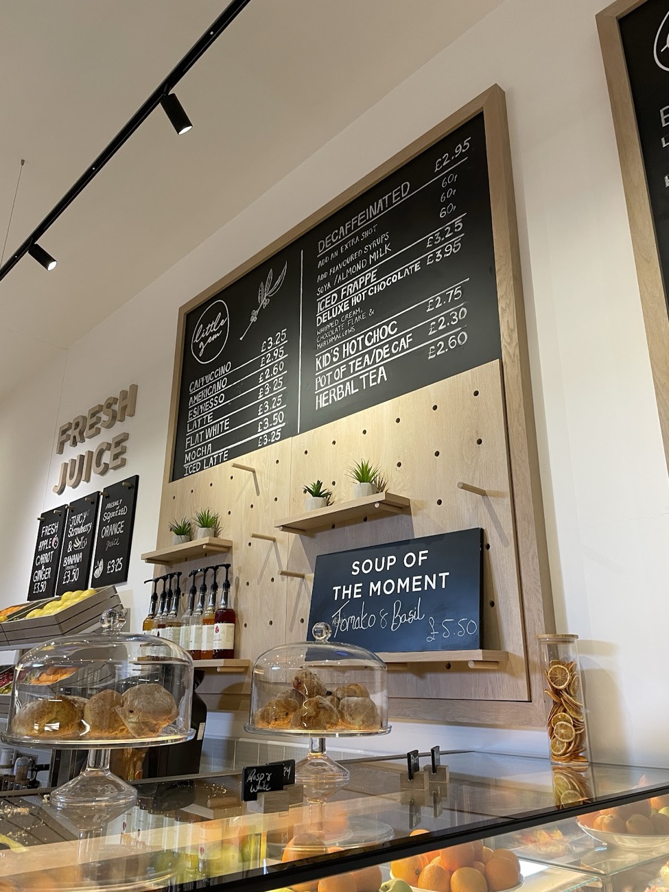 The Little Gem drinks board and Soup of the Moment sign above the bakery counter
