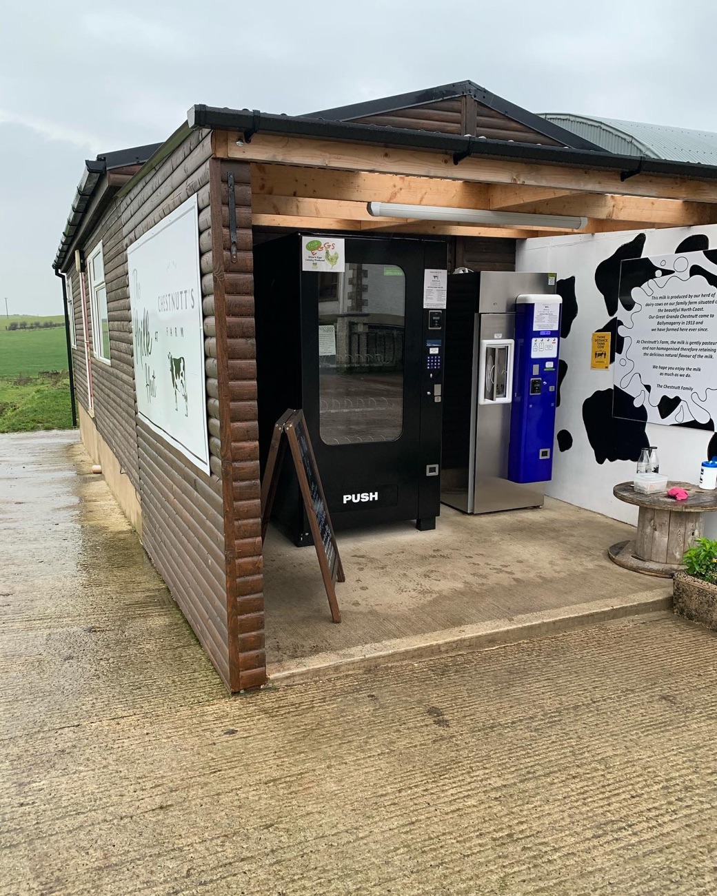 The self-service Milk Hut with its milk vending machines under the canopy