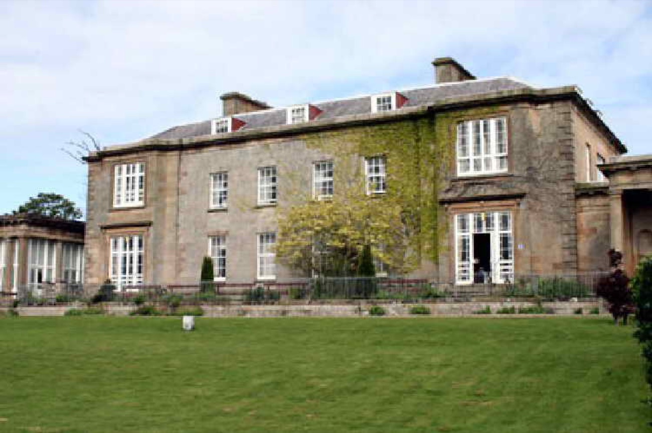 The stone front of Cromore House, its two-storey Georgian frontage softened by ivy
