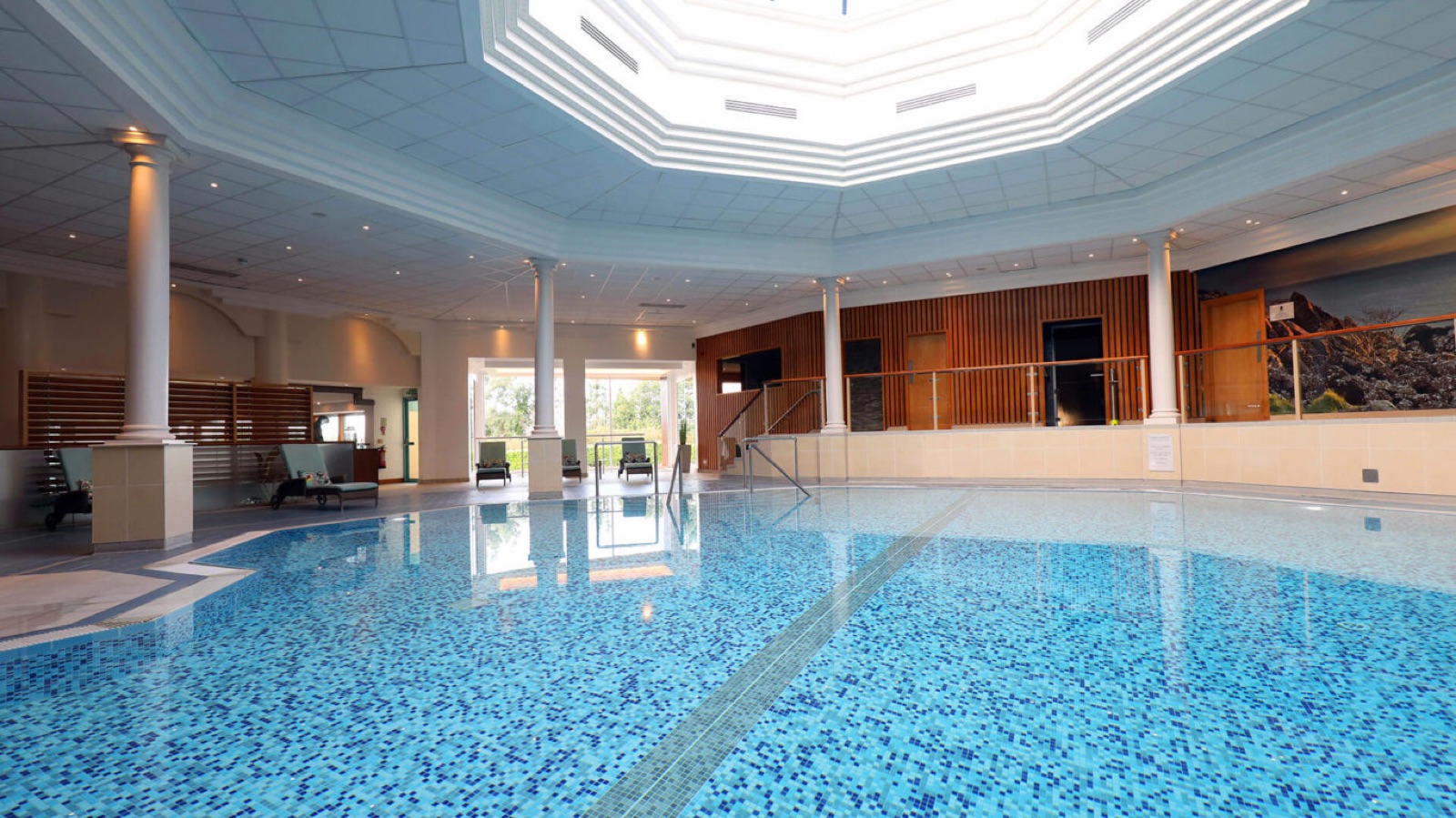 The Culloden spa pool sits under a domed skylight, ringed by pale columns.