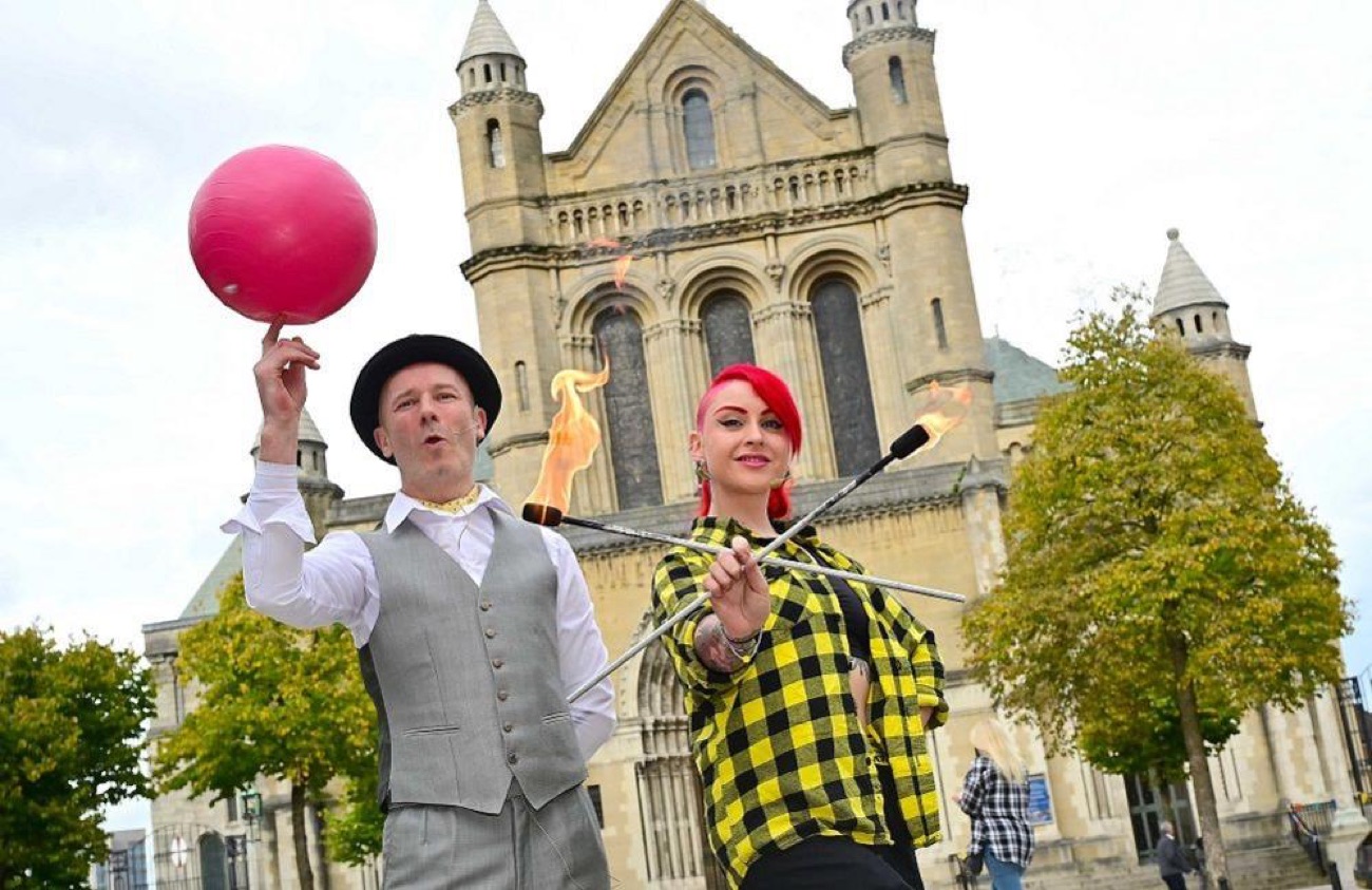 Street circus and fire performers in front of St Anne's Cathedral in Belfast