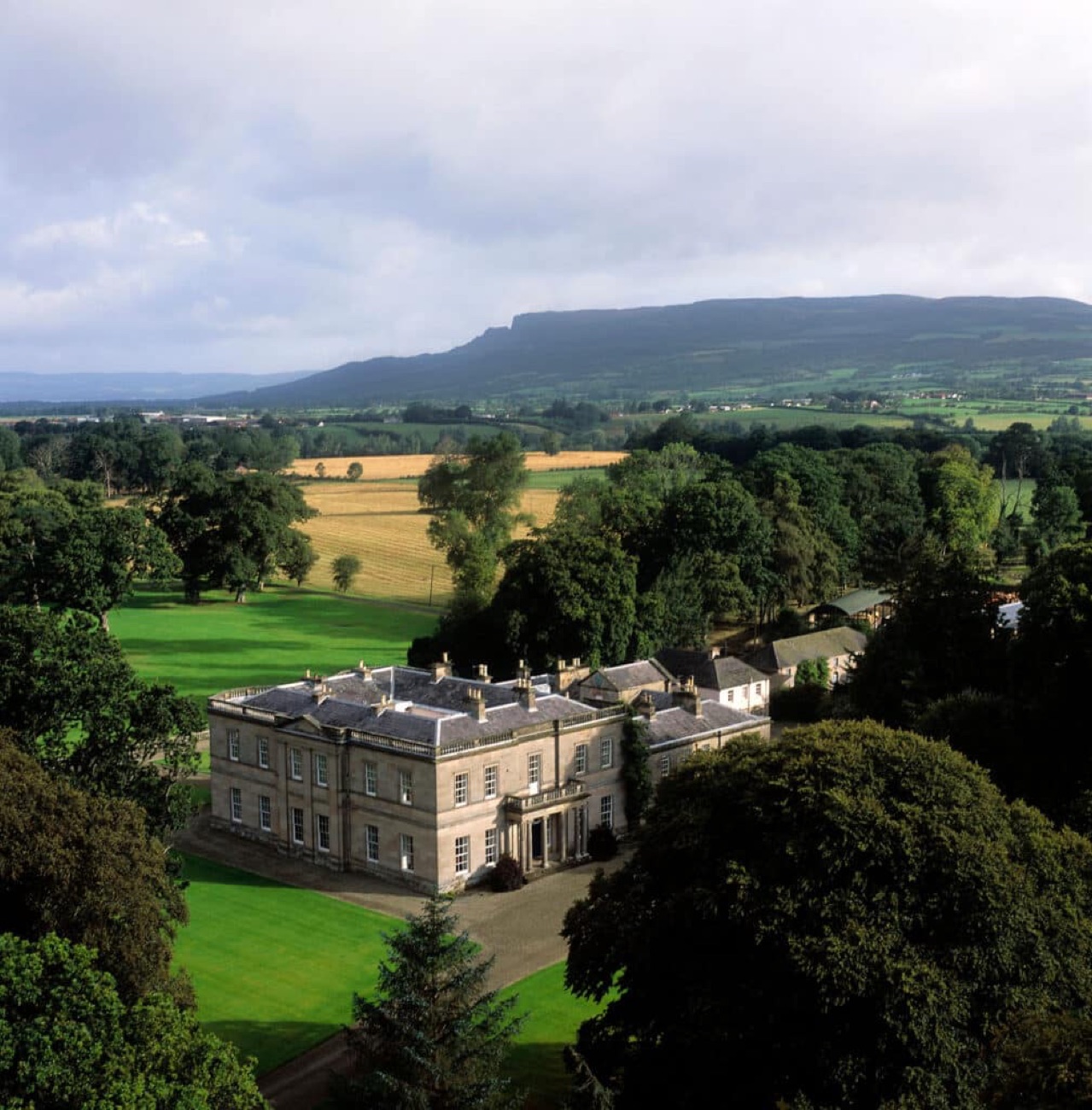 Drenagh mansion set in its parkland with Binevenagh mountain rising behind