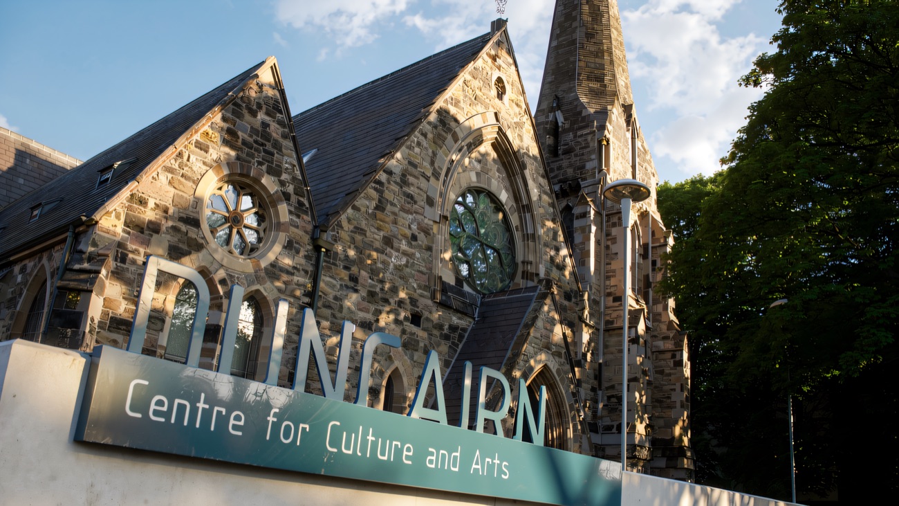 The red-brick Duncairn building with its centre for culture and arts sign