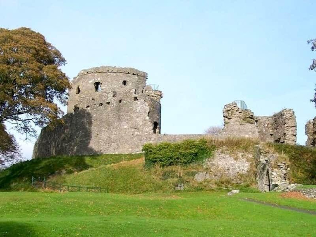 The great round keep of Dundrum Castle standing on its grassy motte