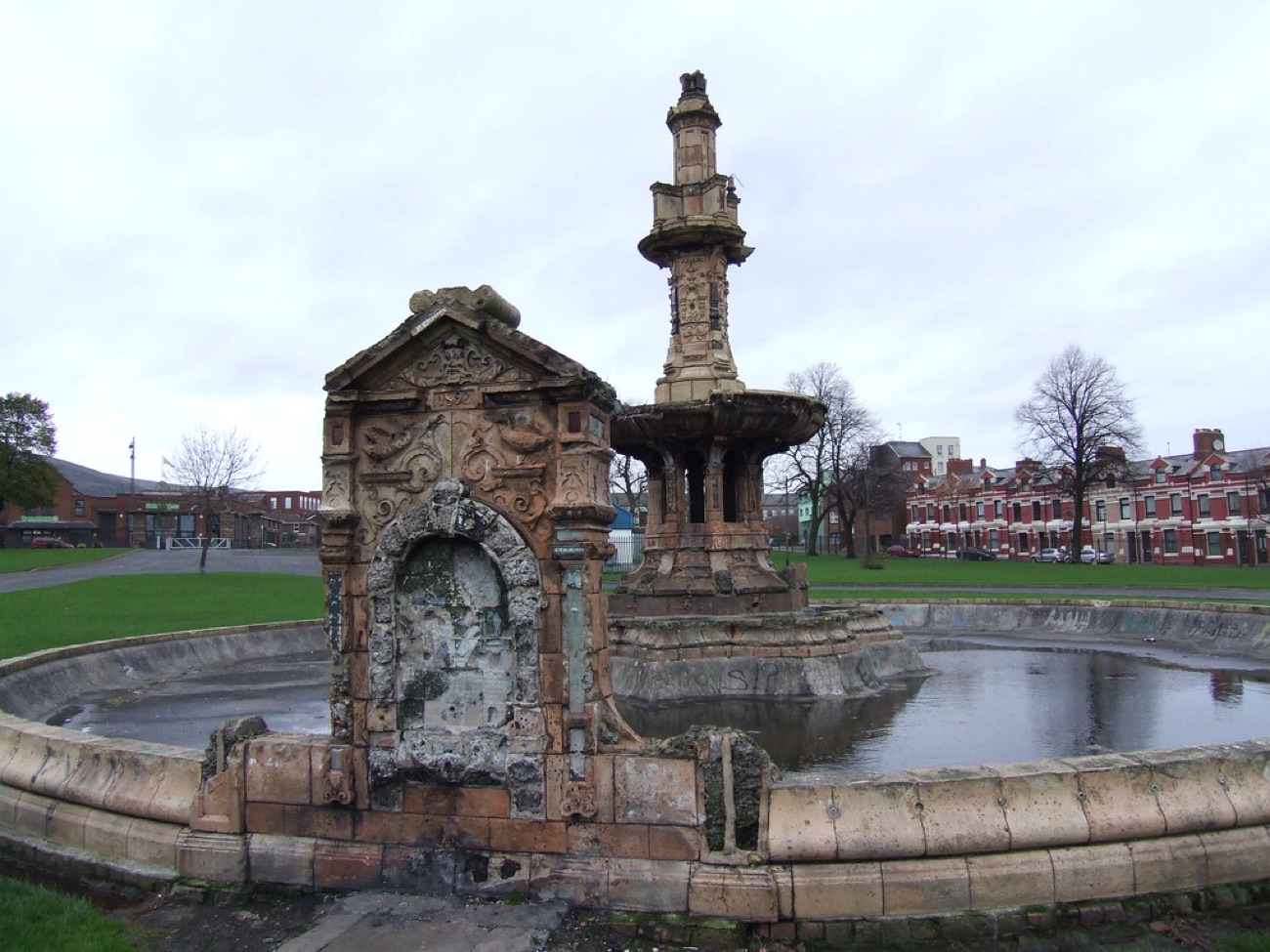 The arched terracotta basin of the Dunville fountain with its circular pool