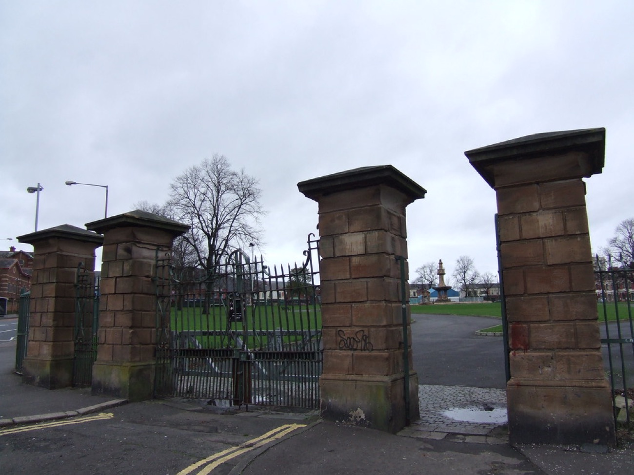 The stone entrance piers and iron gates at Dunville Park on the Falls Road