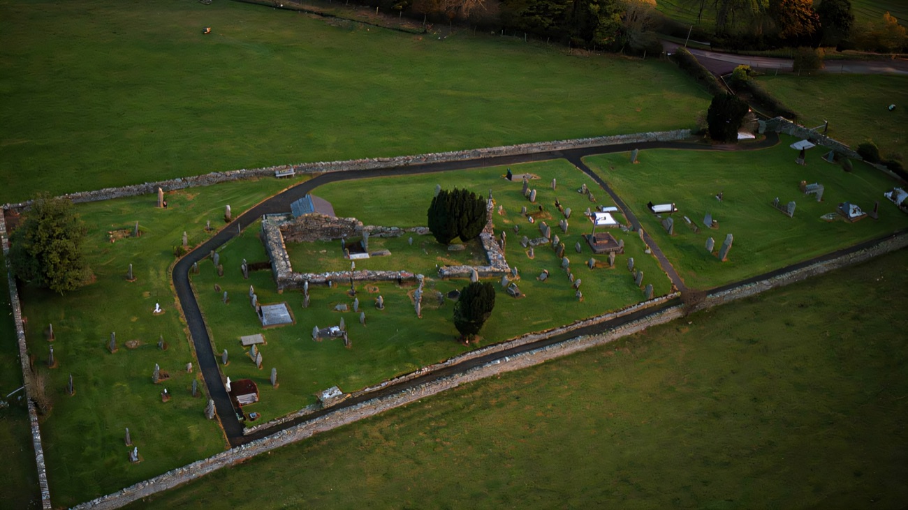 From above, the whole walled enclosure with its ruin and scattered stones