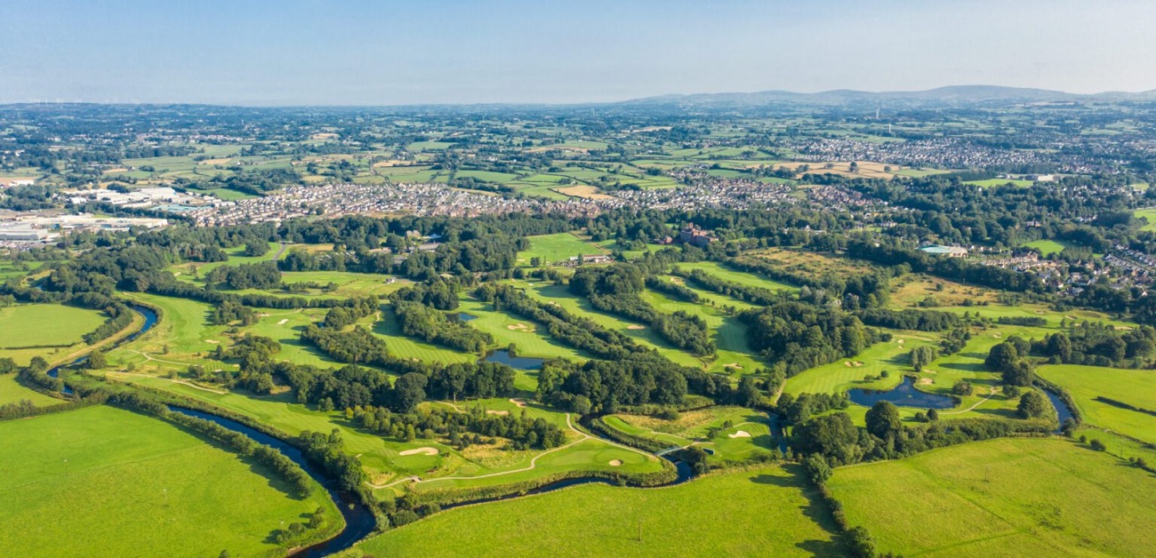Aerial view of the Galgorm estate — the golf course and the River Maine winding through the parkland