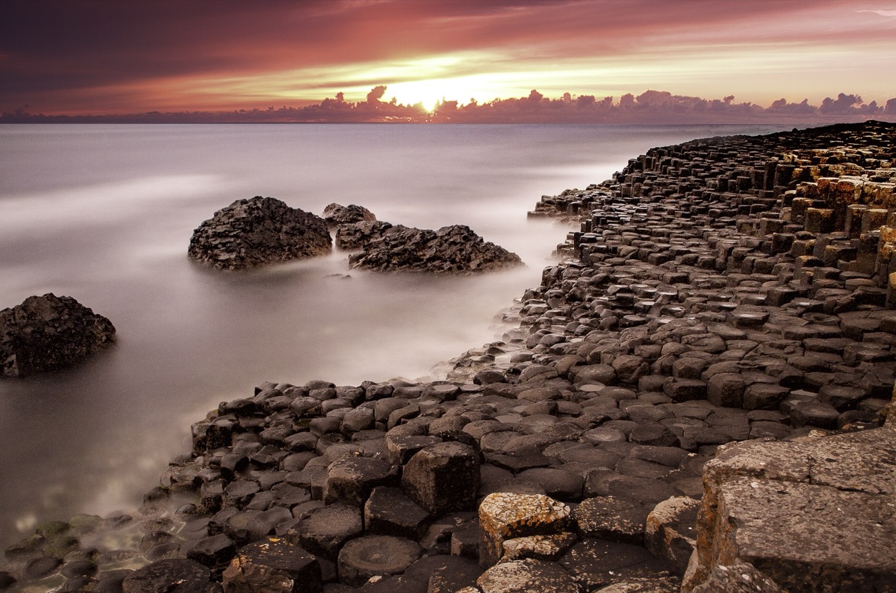 The basalt columns of the Giant's Causeway stepping into the sea