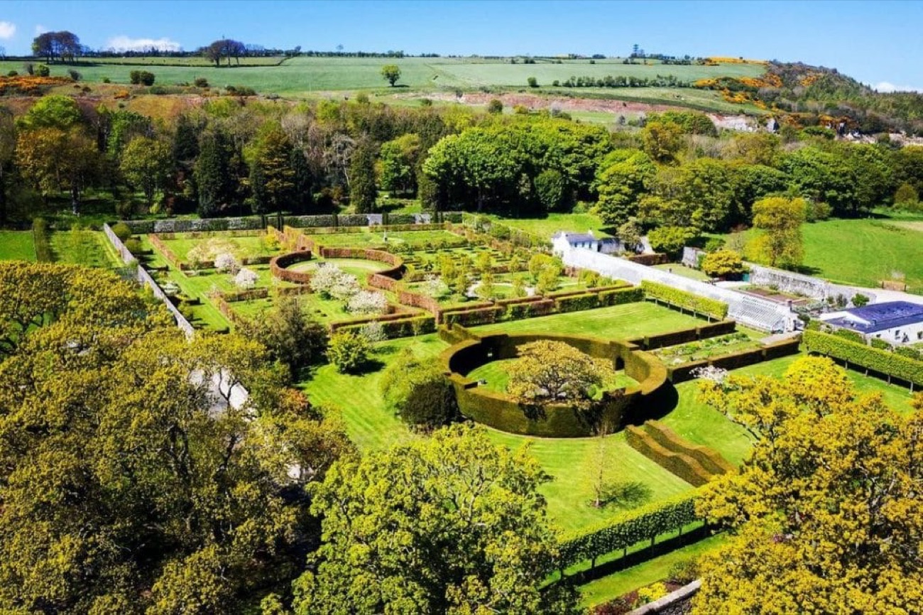 The Glenarm walled garden from above, with clipped hedge beds and mixed borders