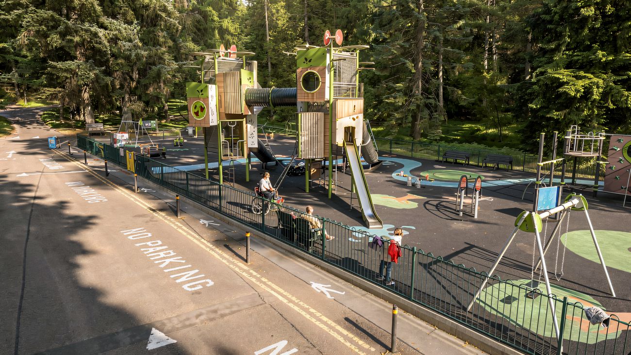 An aerial view of the Gortin Glen destination play park with timber units along the forest road