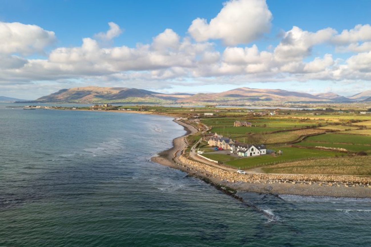 The Greencastle shore on Carlingford Lough with the Cooley mountains rising across the water