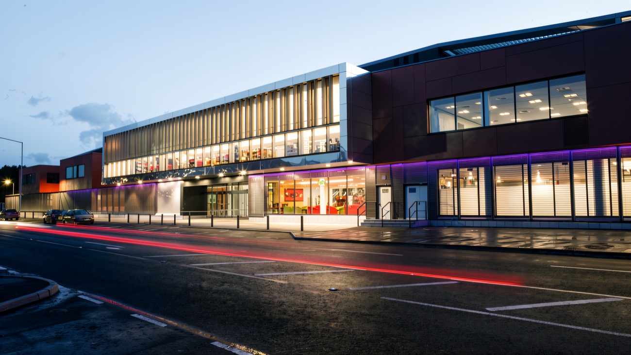 The centre lit up against the evening sky