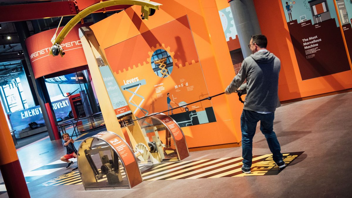 Visitors exploring the colourful hands-on exhibits at W5 science and discovery centre