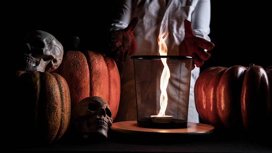 A spooky-science Halloween scene with glowing potions, skulls and pumpkins at W5 Belfast
