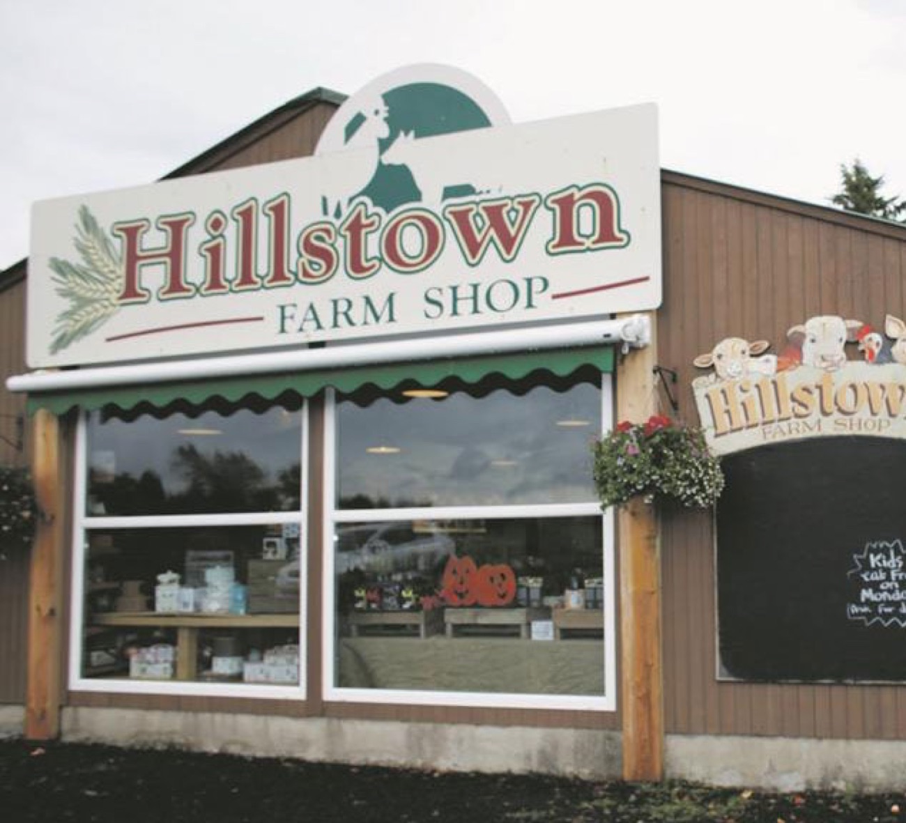 The Hillstown Farm Shop sign above a green awning and the shop window