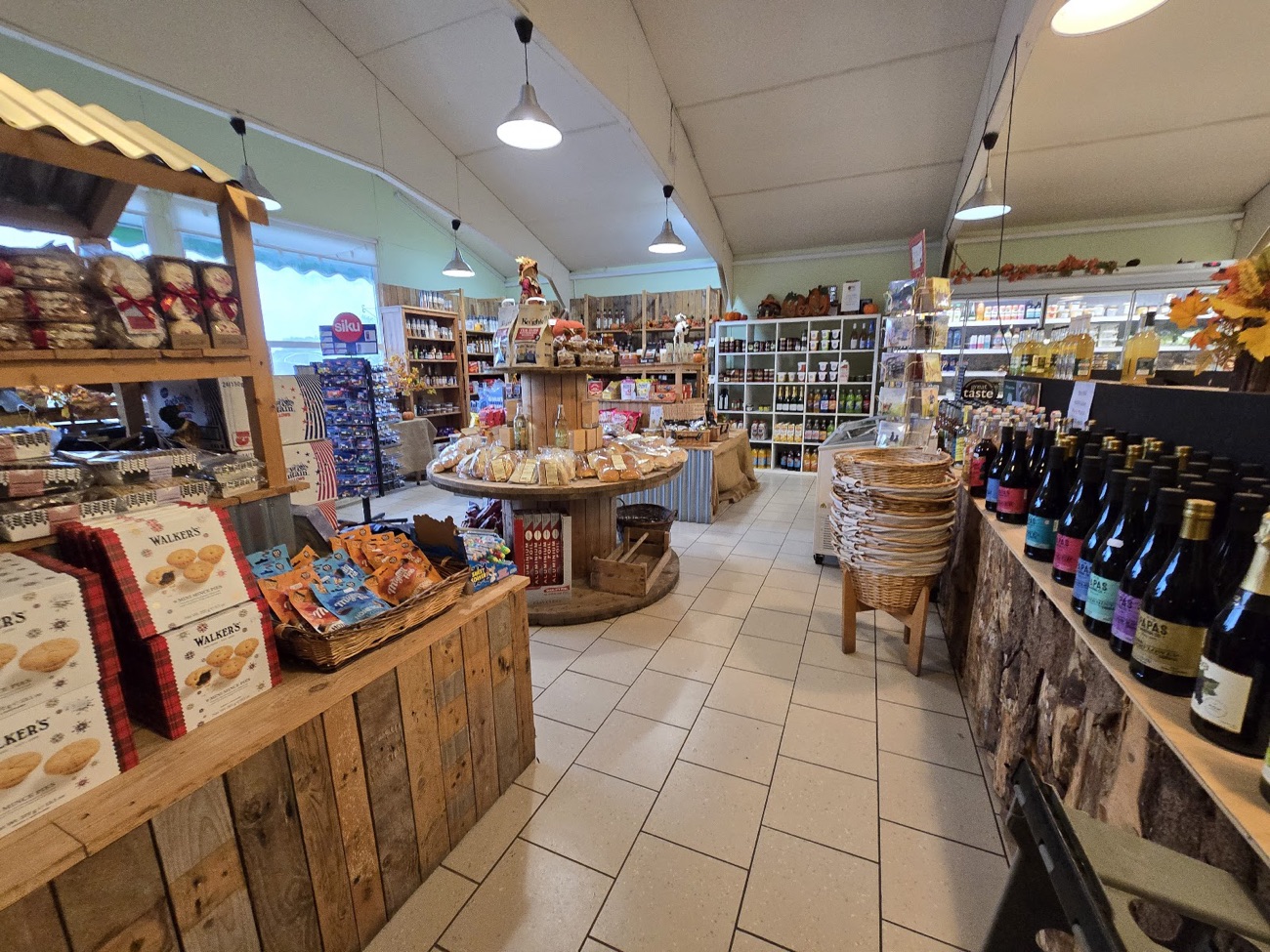 The Hillstown shop floor, wooden shelves of local produce running the length of the room