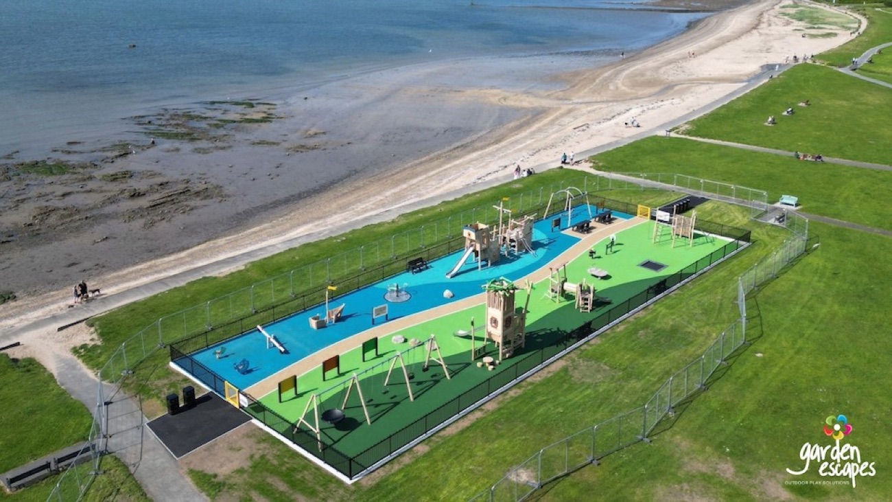 Aerial view of the seafront recreation ground with its play area and games surfacing beside the beach
