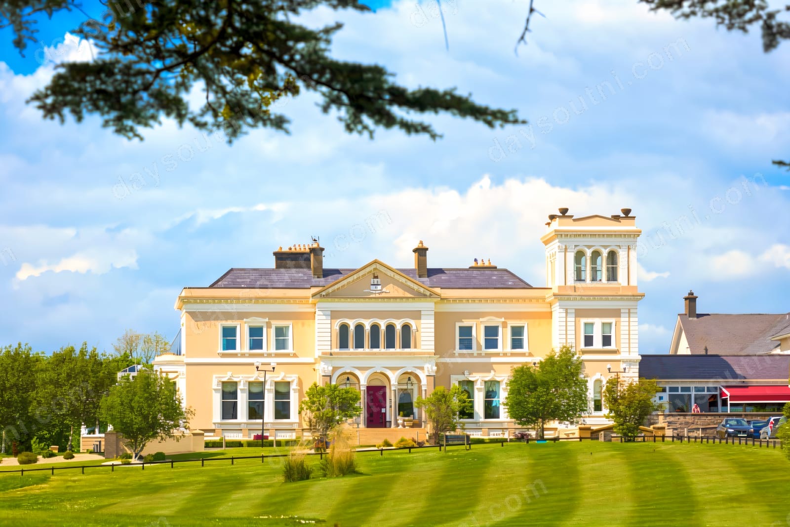 The honey-coloured Victorian Manor House Hotel at Killadeas, with its central tower, arched entrance and wide green lawns