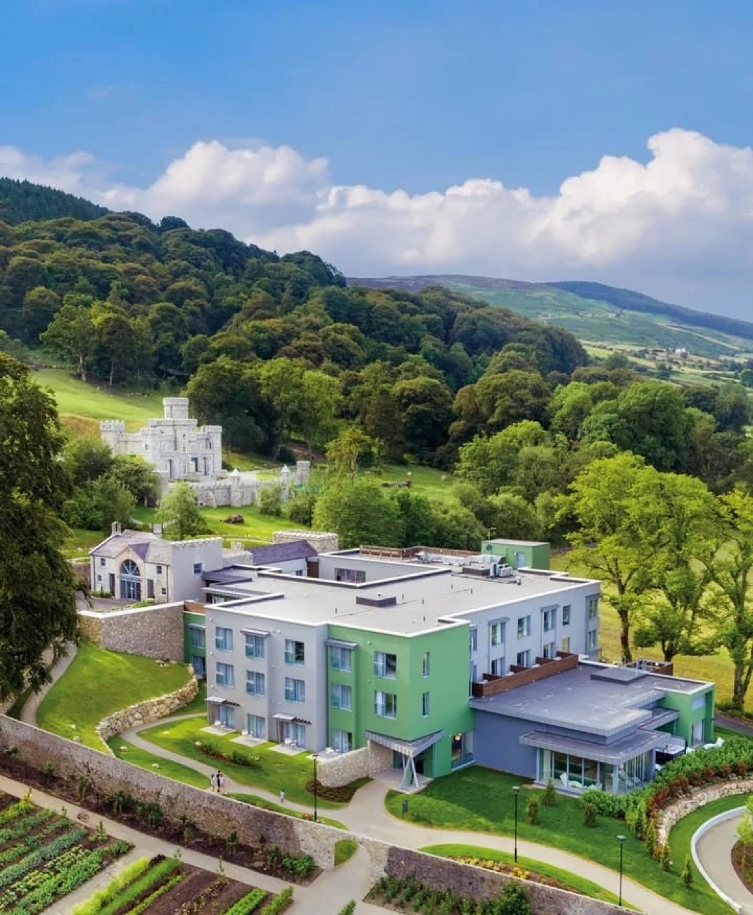 The estate from above, tucked under the wooded slopes of Slieve Gullion with the walled garden below.