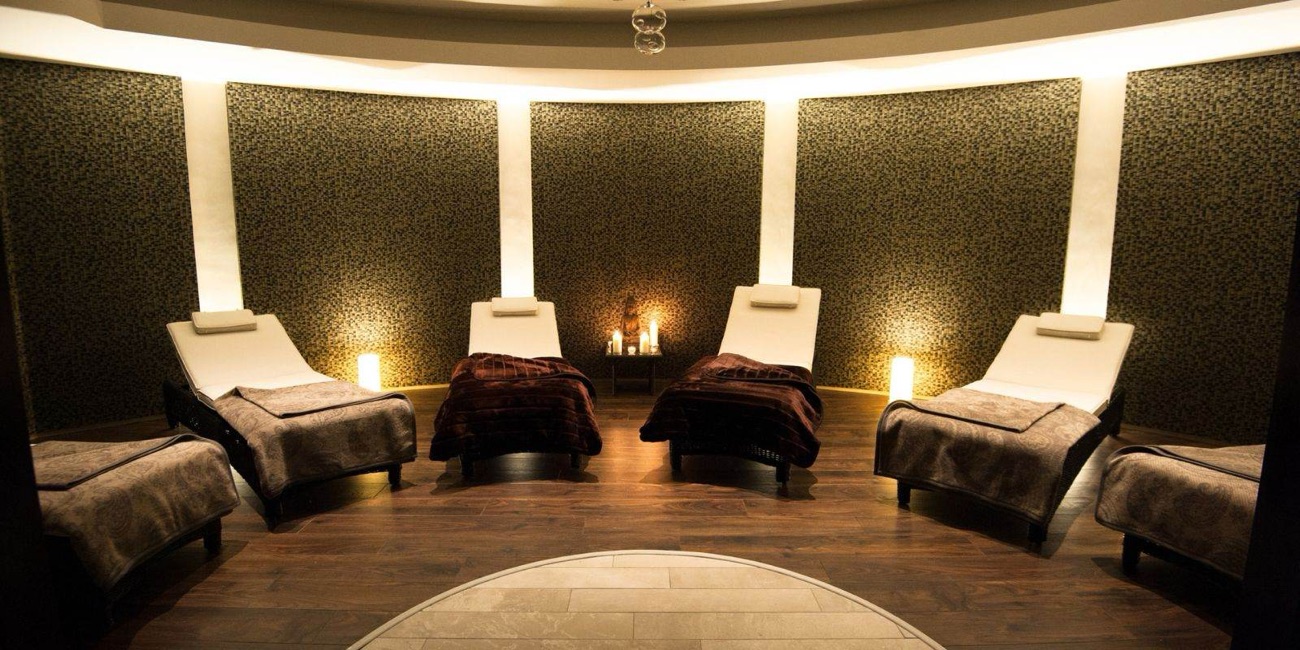 The circular relaxation lounge, with heated loungers and soft lighting.