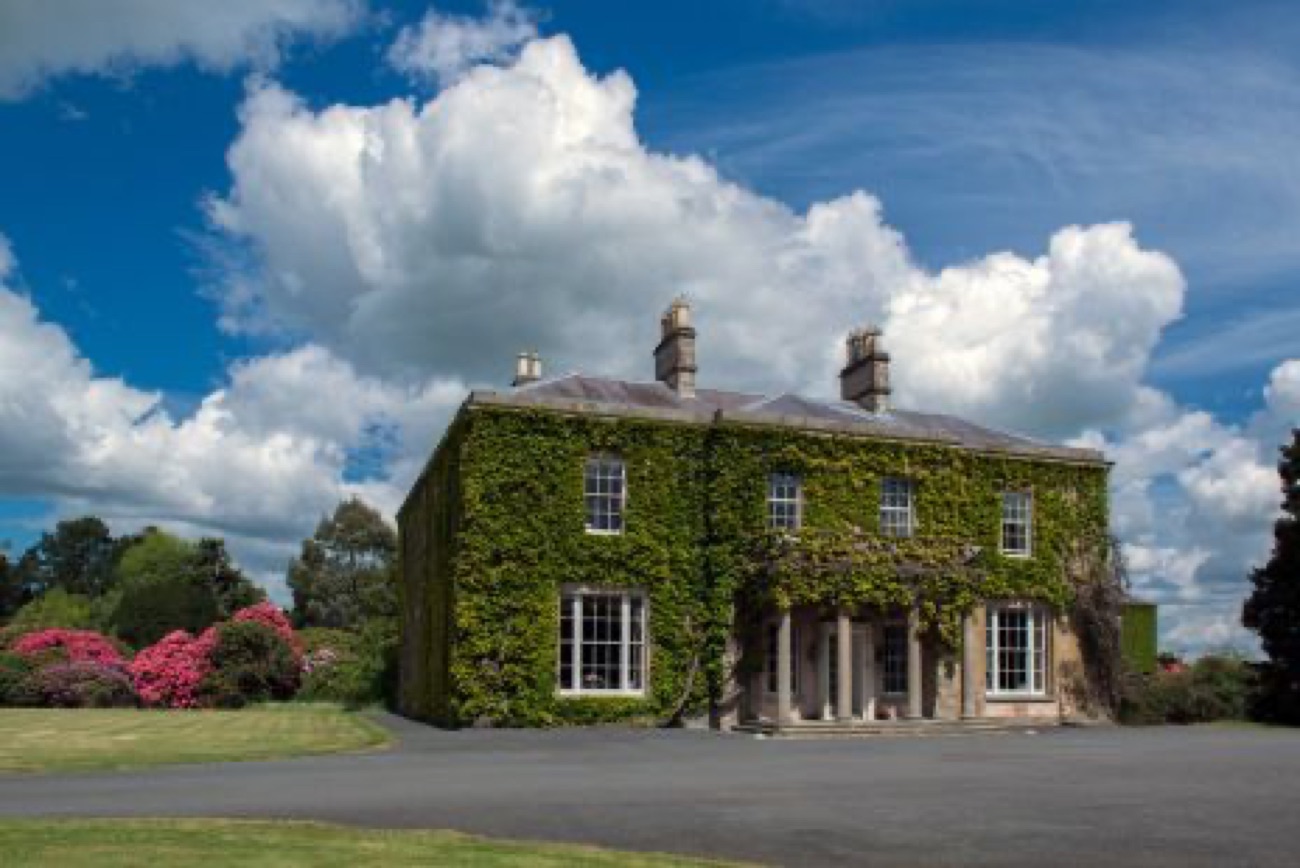 The ivy-clad Georgian house at Larchfield under a big County Down sky