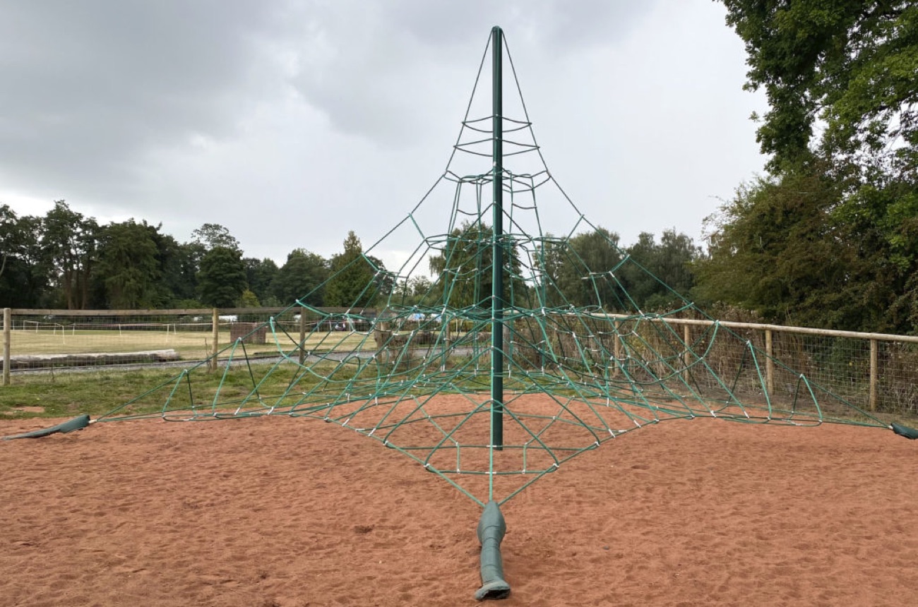 A tall rope climbing pyramid in the play park at Larne Town Park