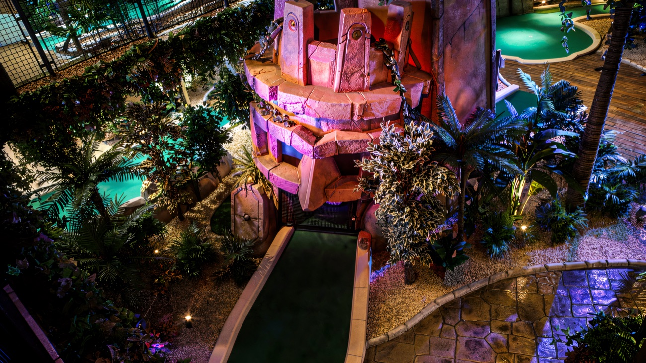 The pink-lit ancient stone temple that forms the course's signature hole