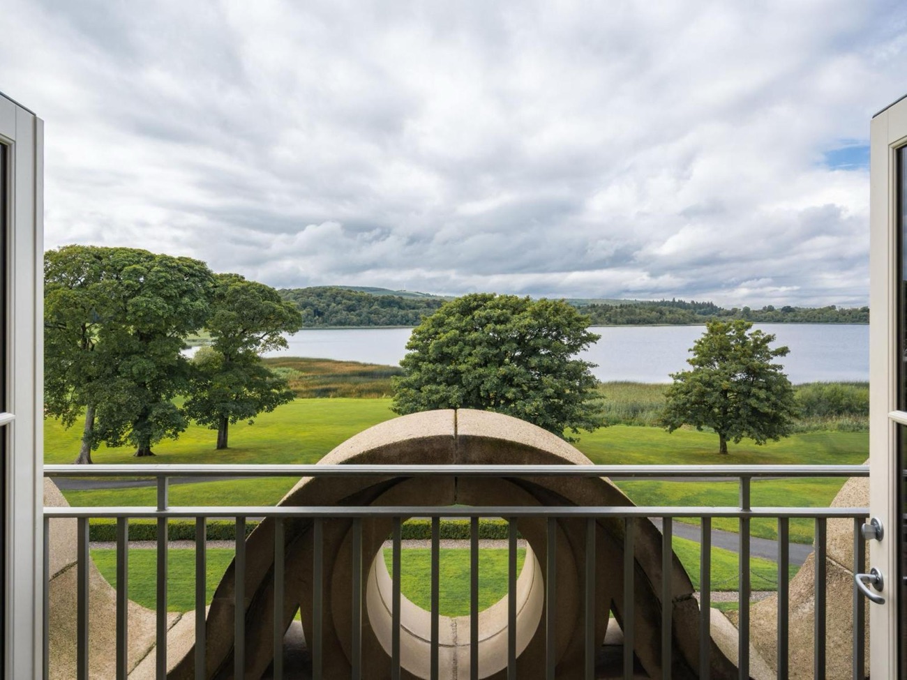 Trees and parkland frame the view out over Castle Hume Lough.