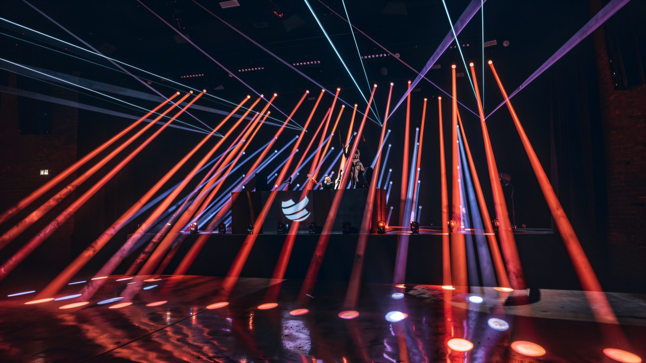 Beams of red and blue light criss-crossing the hall during a show