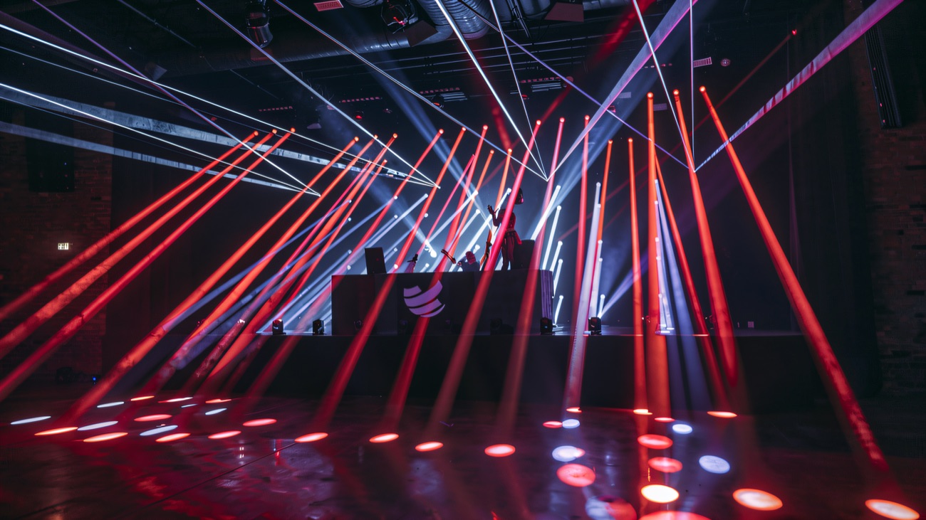 Green lasers fanning out across the empty dance floor