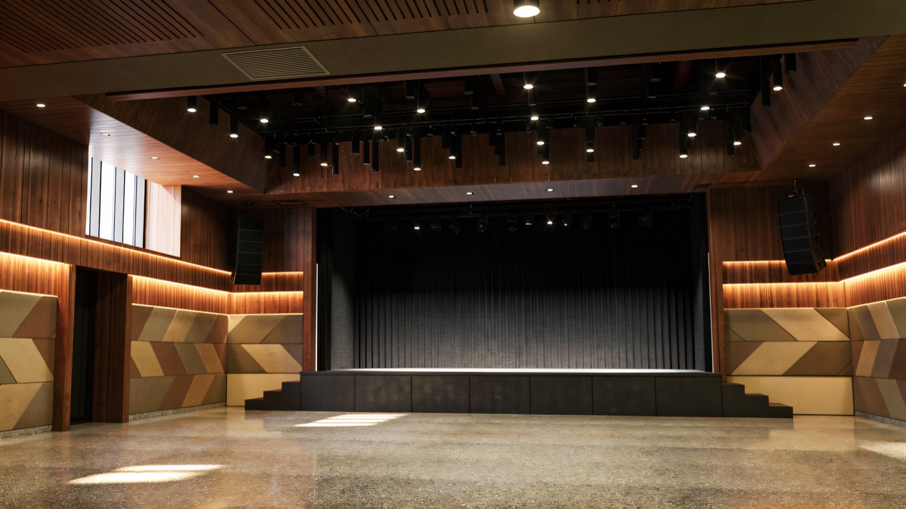 The hall with its stage, lighting rig and timber-lined ceiling