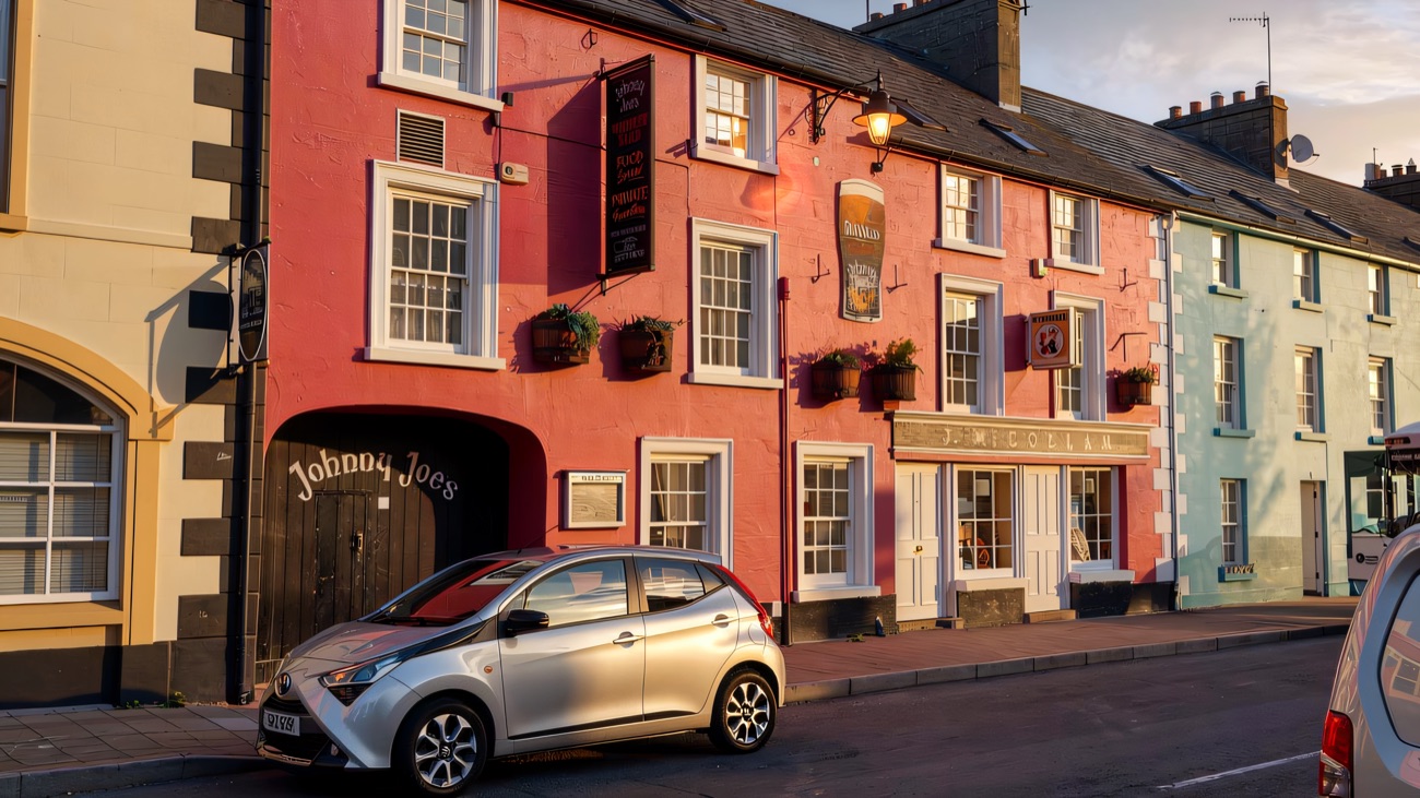 The pink-painted J. McCollam frontage on Cushendall's main street