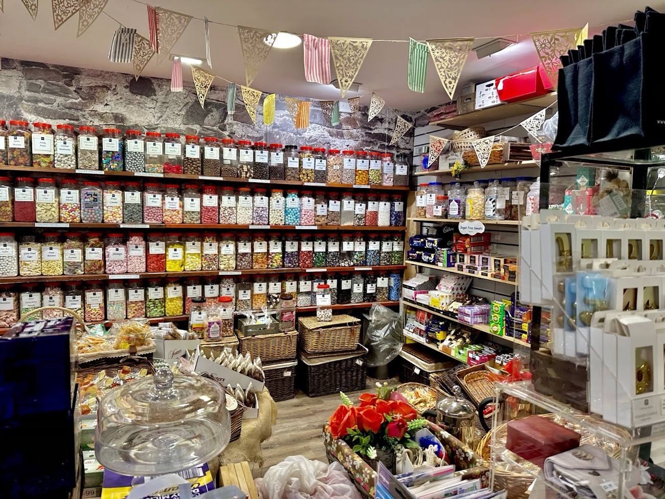 The old-fashioned sweet room at McKee's — walls of glass jars under bunting